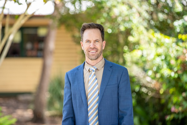 John Hinton, Principal of St Ambrose’s Primary School, standing on school grounds, representing school leadership, approachability and connection with the school community
